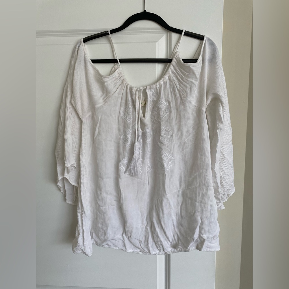 White bell sleeves top from Urban Outfitters, shoulders exposed